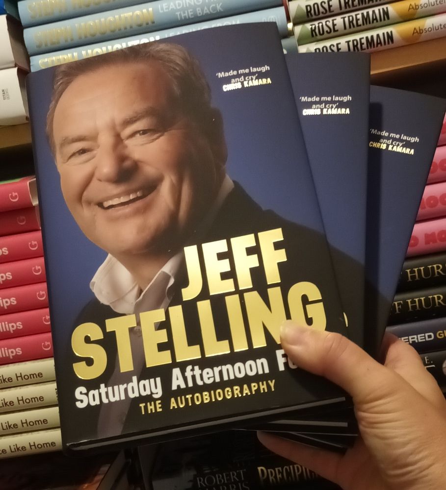 The cover of Jeff Stelling's new book. 

It's a head shot and he's looking at the camera and it seems he pretty happy. 
