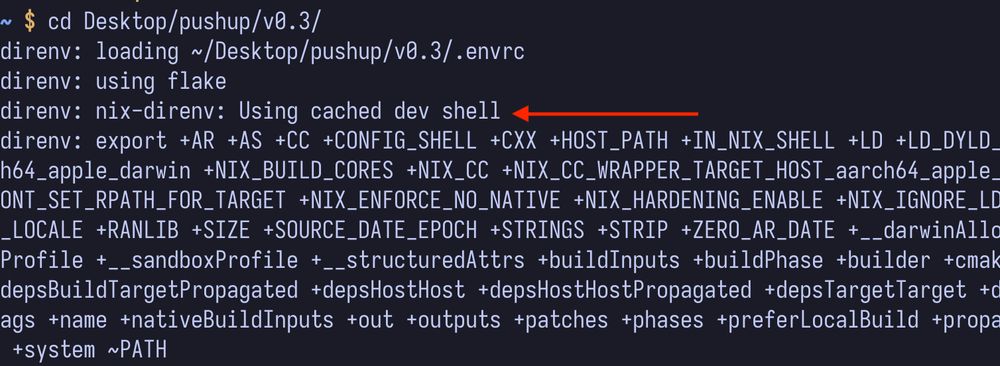 A terminal screenshot showing direnv loading output. The user has changed directory to "Desktop/pushup/v0.3/". The output shows direnv loading an .envrc file, using flake, and loading a cached nix-direnv dev shell. There's a long list of exported environment variables including various Nix-related configuration settings, compiler flags, and build parameters. A red arrow points to the line "direnv: nix-direnv: Using cached dev shell".