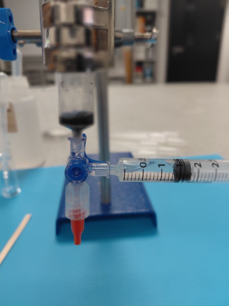 This is separating activated carbon from an aqueous suspension.