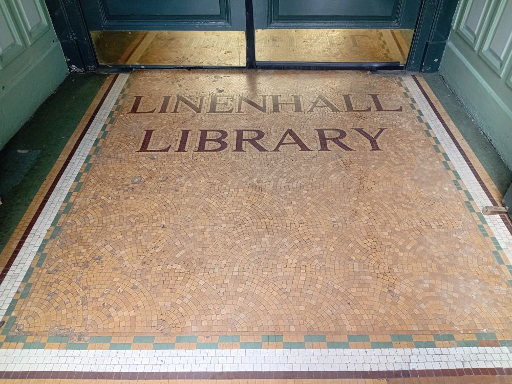 Entrance to the Linenhall Library in Belfast 
Mosaic name on thr floor
