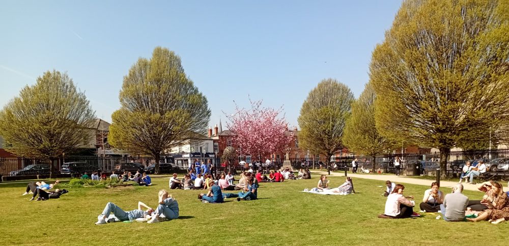 People sitting at lunchtime in a park in Dublin