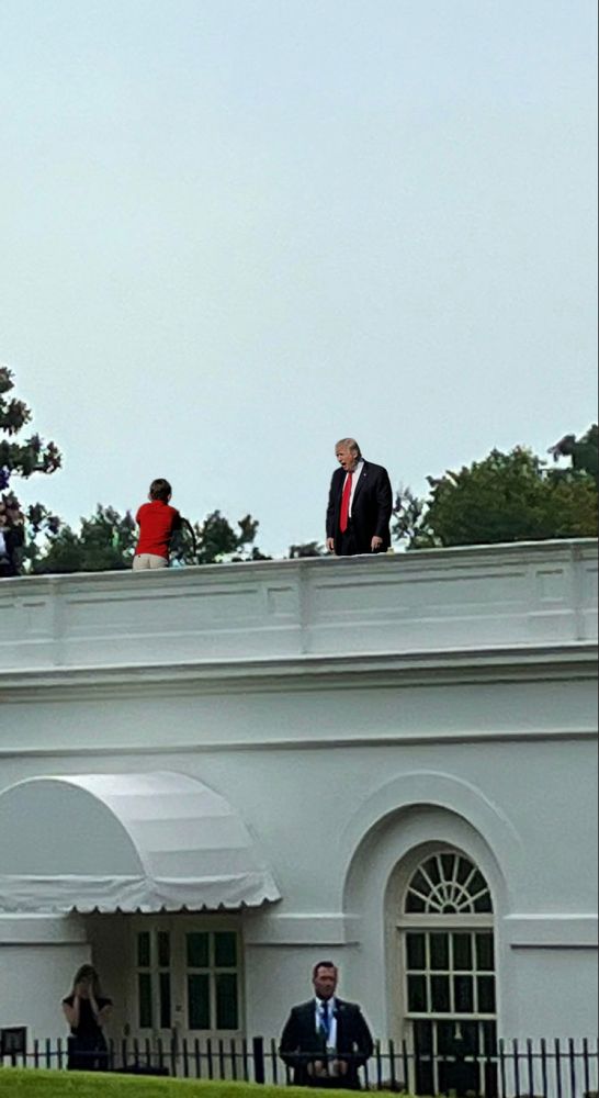 Trump on the roof, yelling at lawnmower kid. 