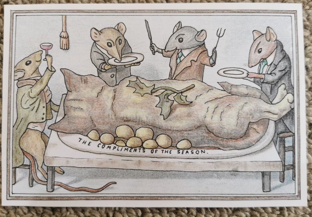 Cartoon image of rats sitting down to Christmas dinner of roast cat. 