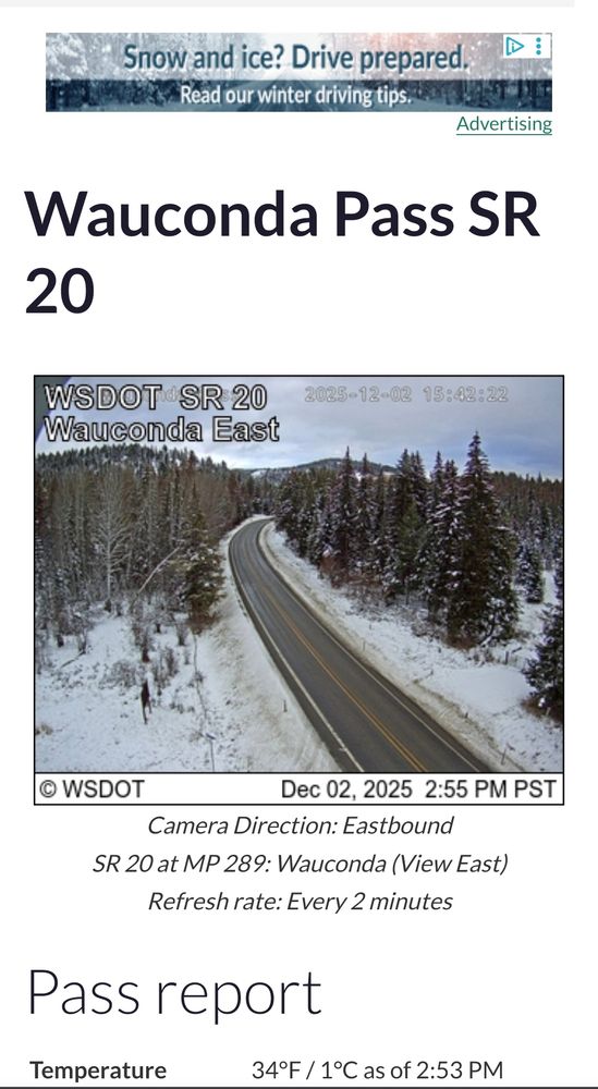 A two lane highway, clear pavement but surrounded by snow and evergreens. Temperature was
34°F / 1°C as of 2:53 PM 12/02/2025, elevation at 4310 ft / 1314 m.