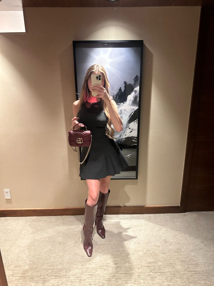 Girl with long blonde hair with cherry red Gucci bag 