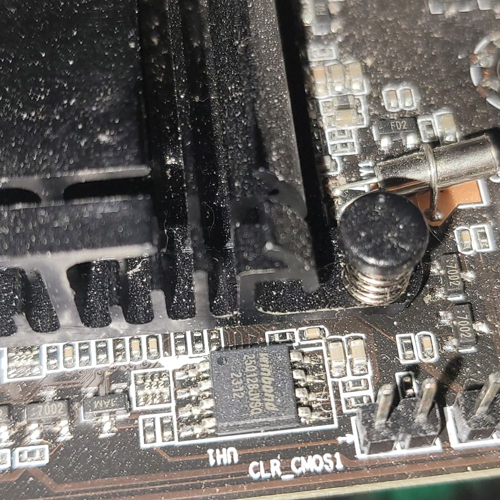 Photo of a PC motherboard showing the BIOS chip.