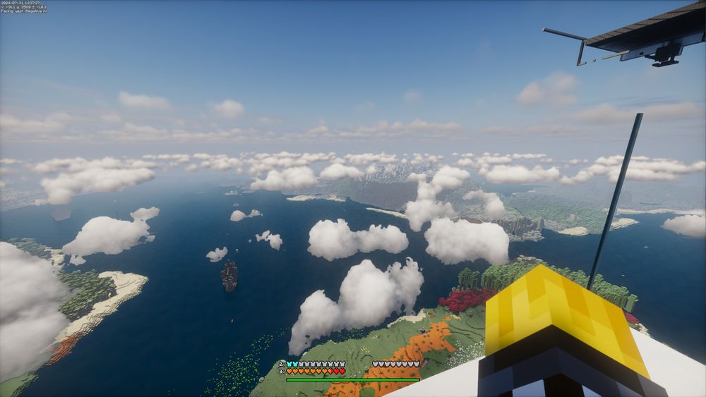 A view of a Minecraft world from atop a giant tower. There's a mob farm to the right.