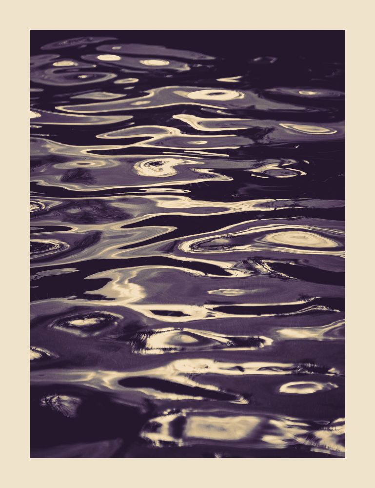 Abstract monochrome photo of the dark surface of a pool reflecting light