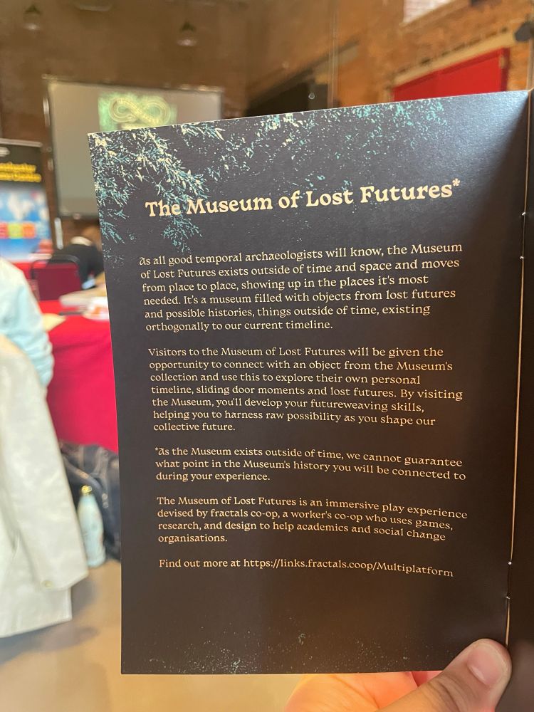 A photograph of a conference programme describing the Museum of Lost Futures. The text is available at https://links.fractals.coop/Multiplatform 