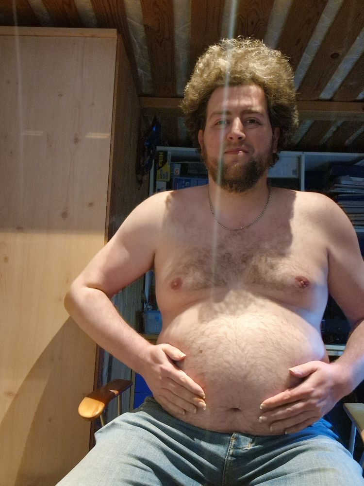 Posing showing off my belly front facing sitting 