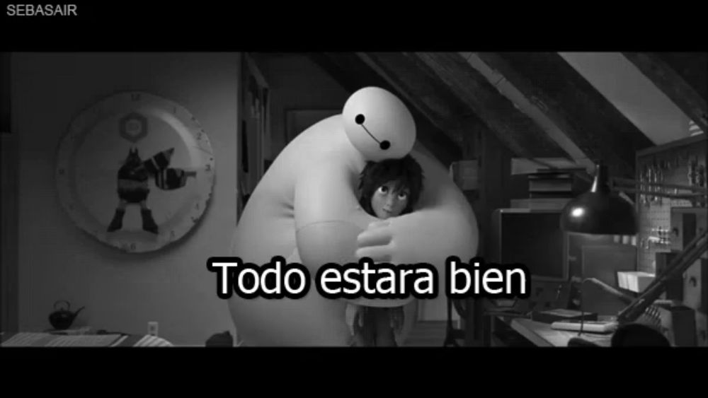 a black and white photo of a boy hugging a big hero 6 character with the caption todo estara bien