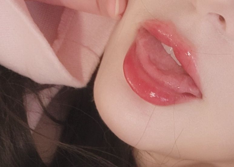 Aeris's mouth up close. Her soft tongue is visible.