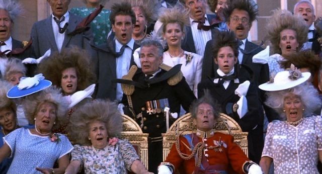 Photo from the movie King Ralph where the royal family are having a massive family portrait taken and they all die in an explosion.. 