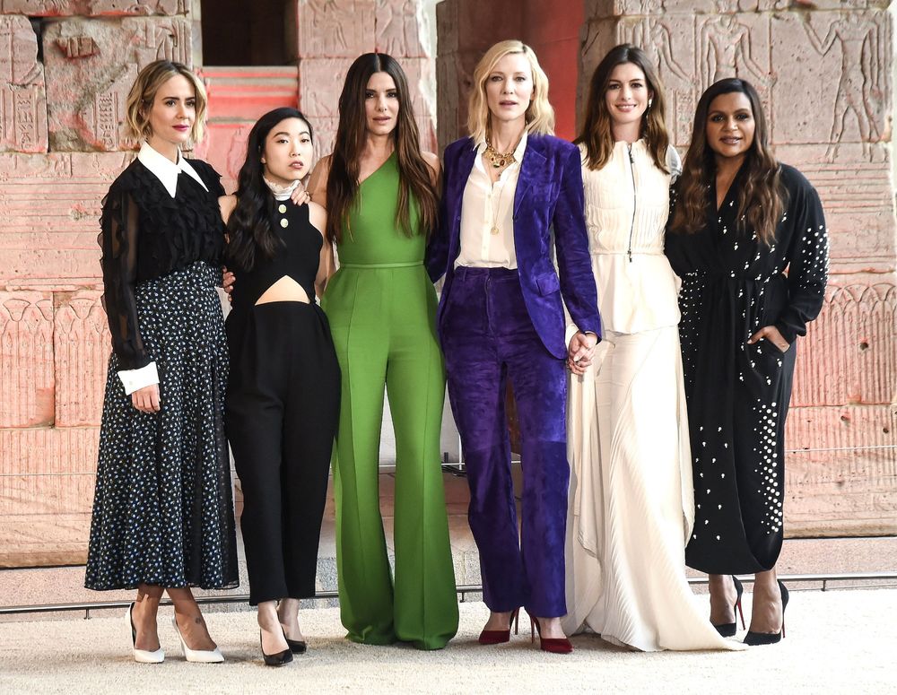 A cast photo from the movie Ocean's Eight.

Sarah Poulson
Awkwardness
Sandra Bullock
Cate Blanchette
Anne Hathaway 
Mindy Kaling

They all look stunning and fully capable of robbing an art museum..