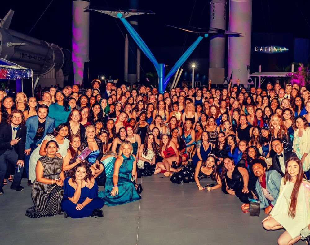Large group photo of the Space Gala attendees standing at the entrance to Kennedy Space Center's rocket garden. Sherie and I are approx. 3 rows back on the left side.