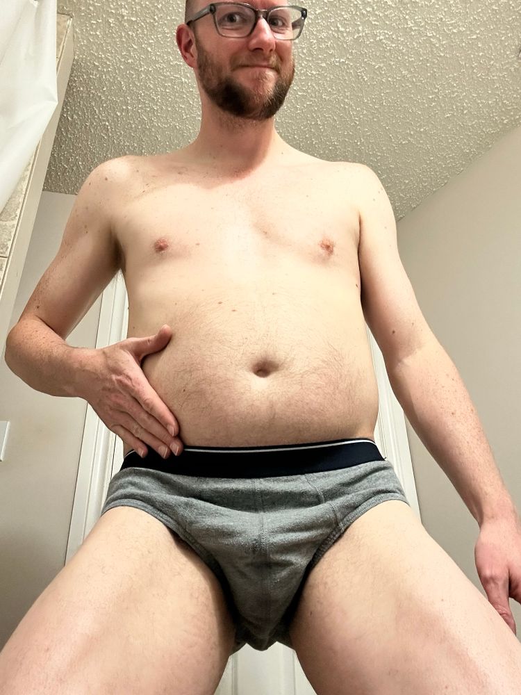 A picture of me in my briefs with a full belly. I’m crouching a bit because I couldn’t find something the right height to put the phone on. Don’t judge me.