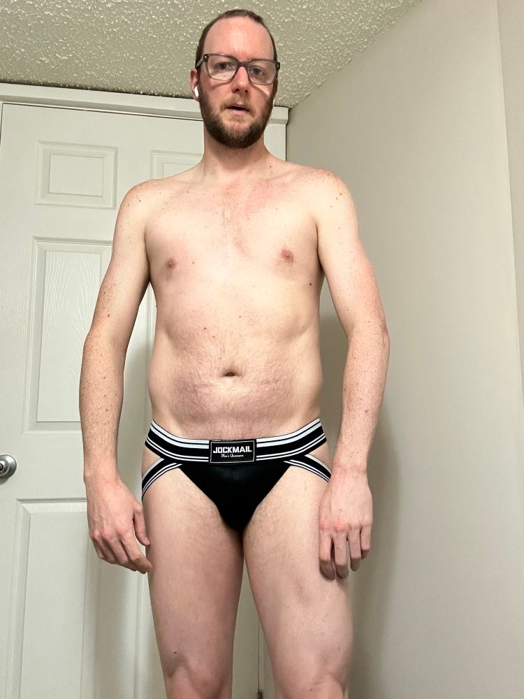 A picture of me in a black and white jock facing forward.