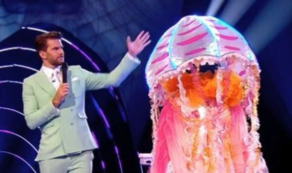 A screenshot from The Masked Singer featuring a performer in a jellyfish costume.