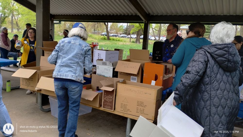 Volunteers package and check through donated food 