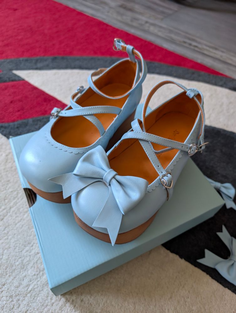 Light blue shoes with wooden soles