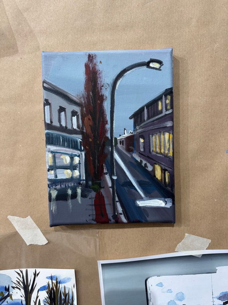 Acrylic painting showing houses on a street in Hamburg. A large tree with reddish-brown foliage is planted on one side of the sidewalk, casting its shadow in the foreground. 