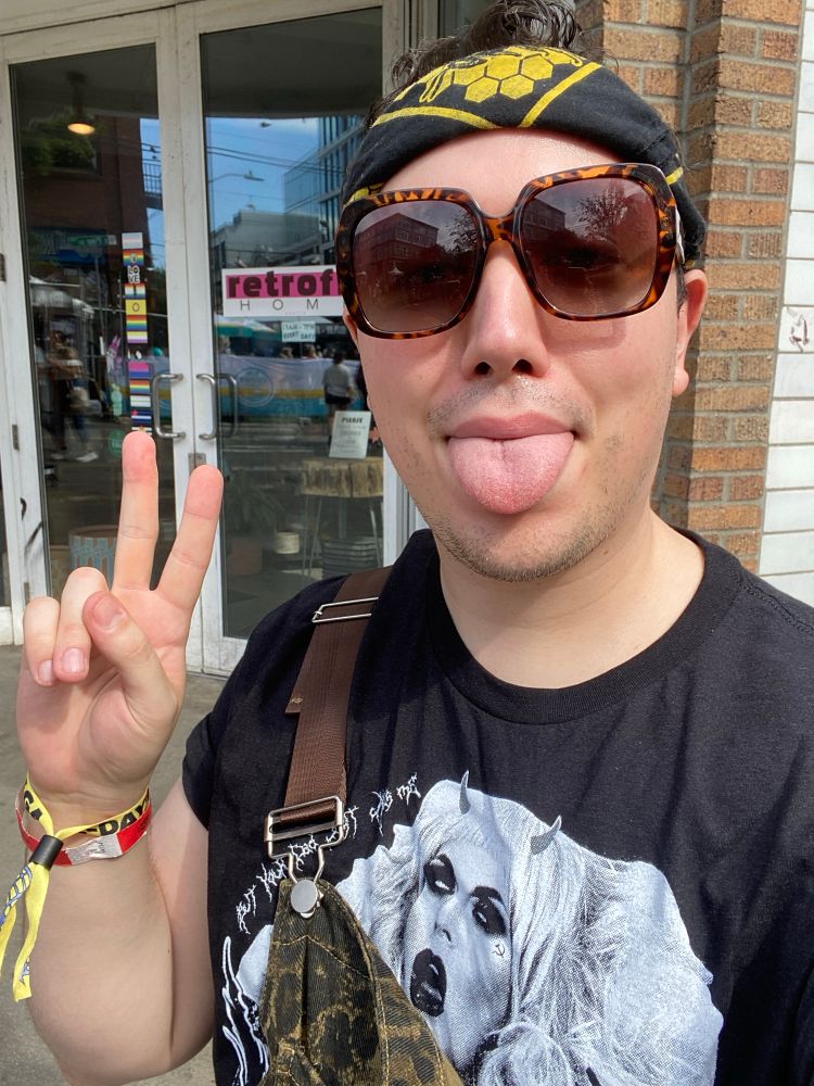 me holding a peace sign while wearing a Katya shirt