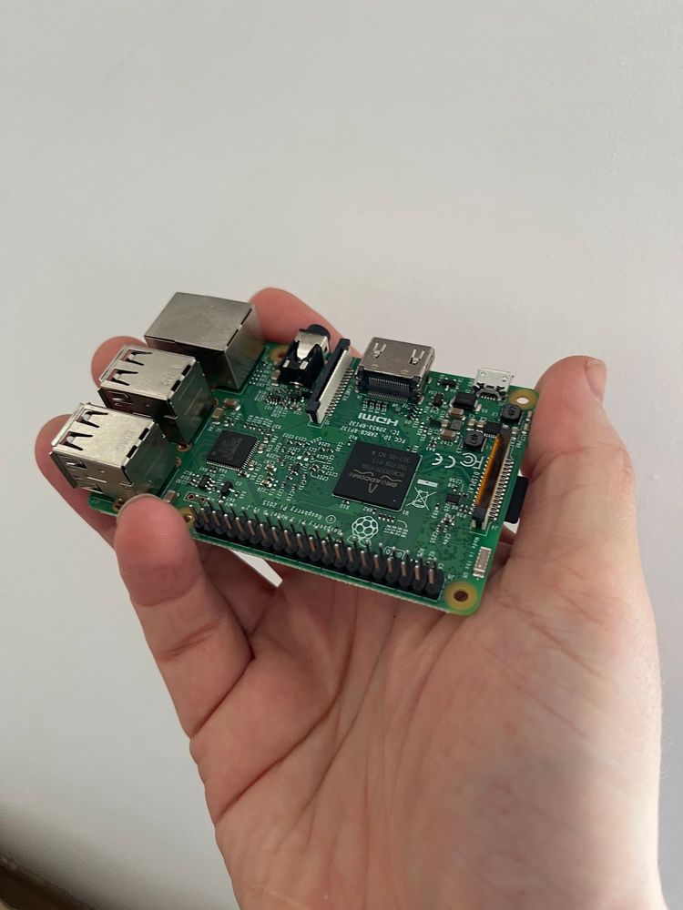 A Raspberry Pi board in a hand