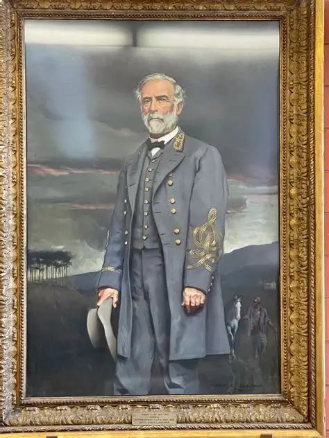 Portrait of Robert E. Lee with a slave leading his horse in the background.