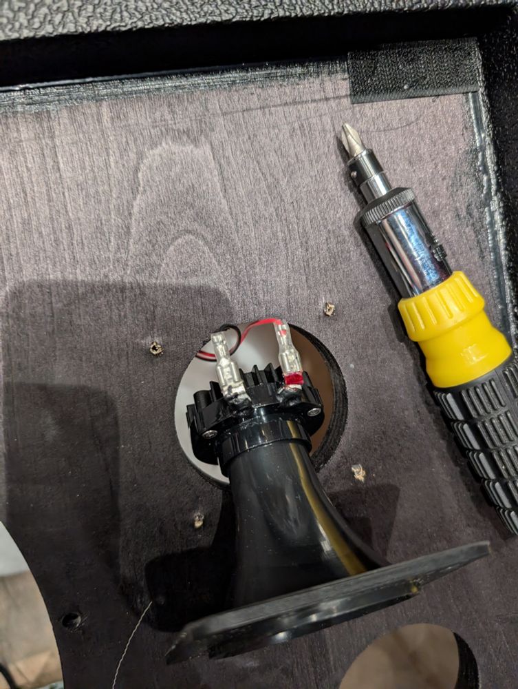 Tweeter speaker removed from Fender FR12 to show wire connections