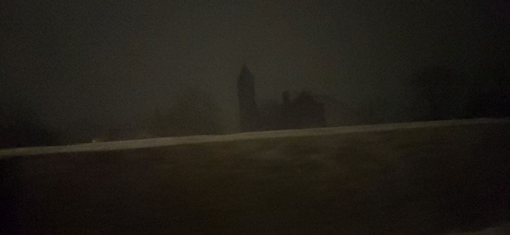 Highway. Darkened photo. Silhouette of a church.