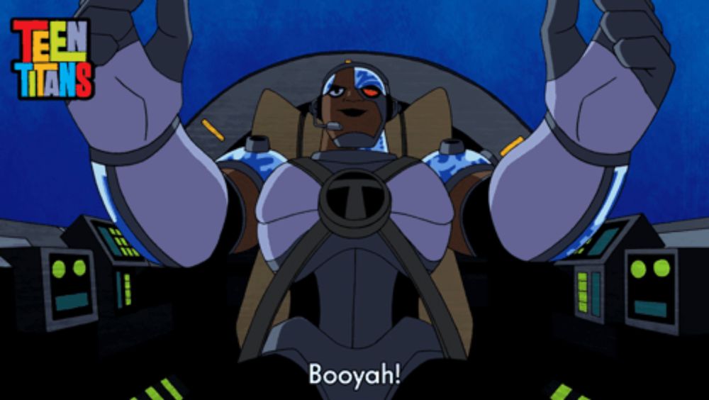 a cartoon character from teen titans is sitting in a cockpit and says booyah