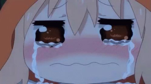 a close up of a crying anime girl with tears coming out of her eyes .