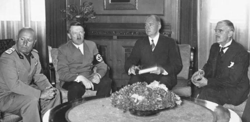 Mussolini and Hitler meeting with Daladier and Chamberlain, with the latter selling out the Czechs at Munich in 1938.