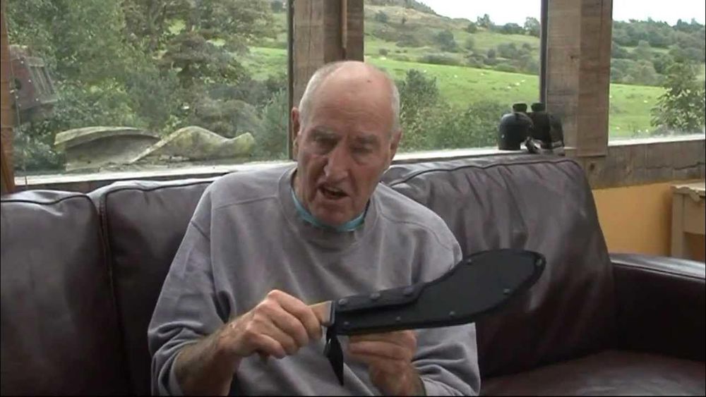The legend that is Lofty Wiseman holding one of his signature knives 