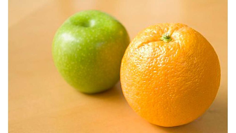 An apple and an orange. The phrase "comparing apples and oranges" is idiomatic for the "false equivalence fallacy"