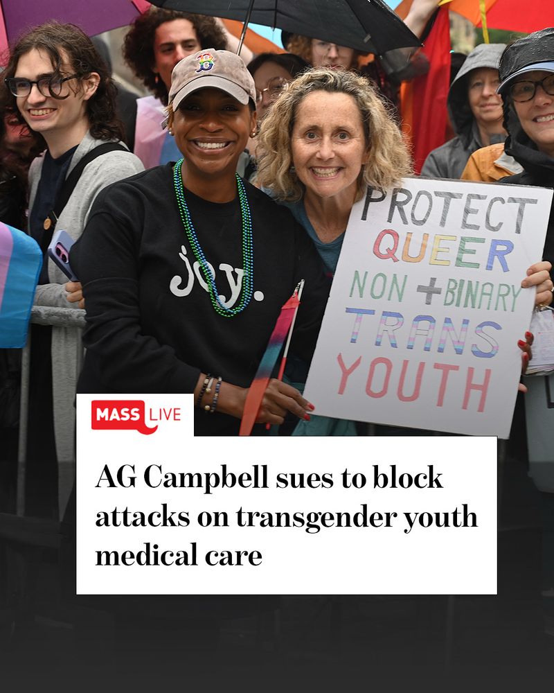 AG Campbell poses with a woman holding a sign that reads, “Protect queer, non-binary, and trans youth”