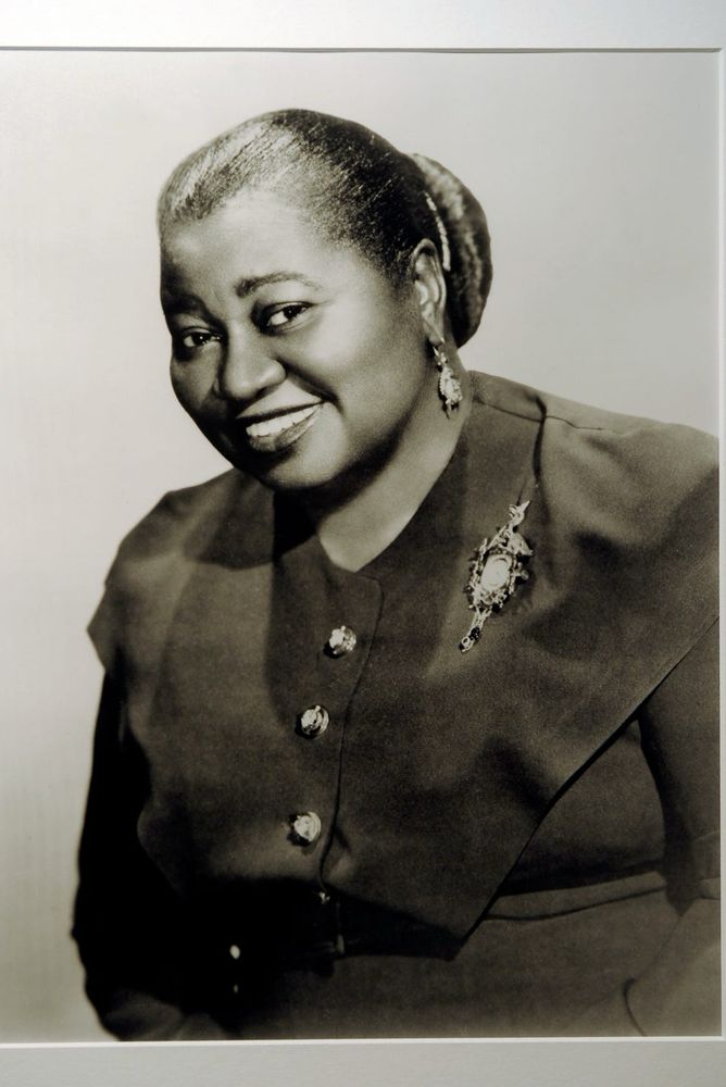 Actress Hattie McDaniel in her black dress adorned with a broche 