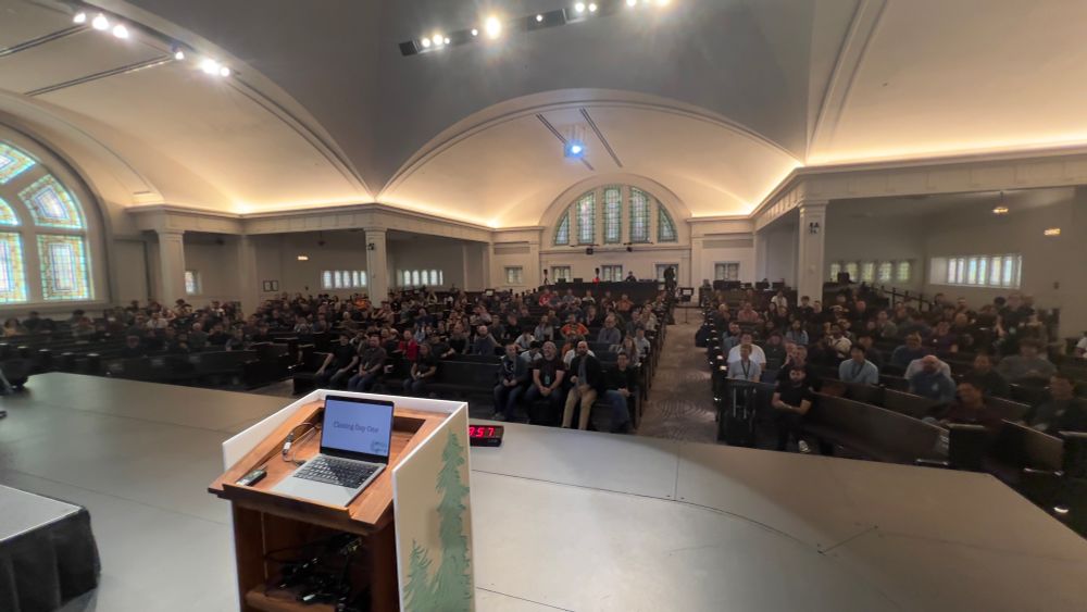 An audience of 500 people at CascadiaJS is shown from the stage.