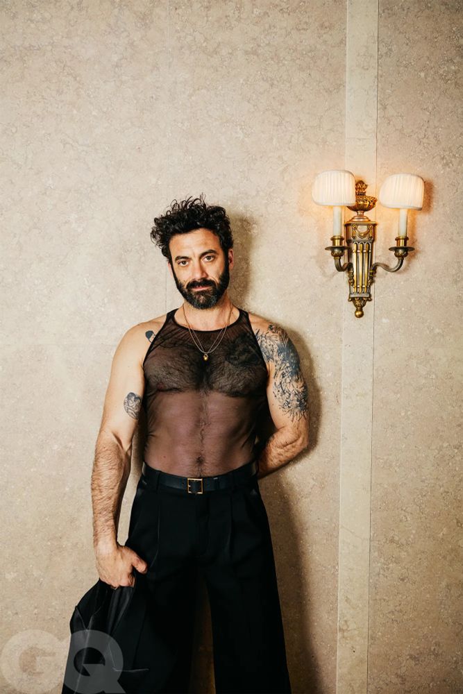 Morgan Spector in a mesh tank top and velvet(?) trousers for GQ looking absolutely fucking egregious 