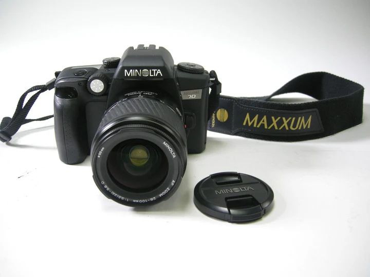 A Minolta Maxxum 70 with a zoom lens 