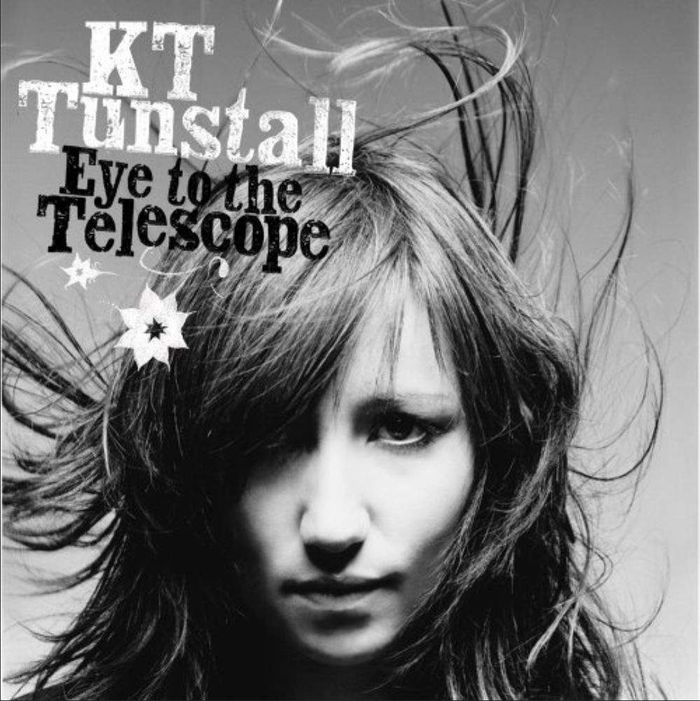 Album cover: KT Tunstall's "Eye To The Telescope" (black and white photo; KT's hair is blowing upwards. Her name in white letters; the album name in black)