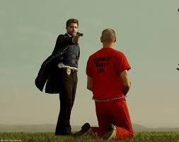 Final scene of Se7en and Brad Pitt has a gun on Kevin Spacey, who is kneeling, ready to die.