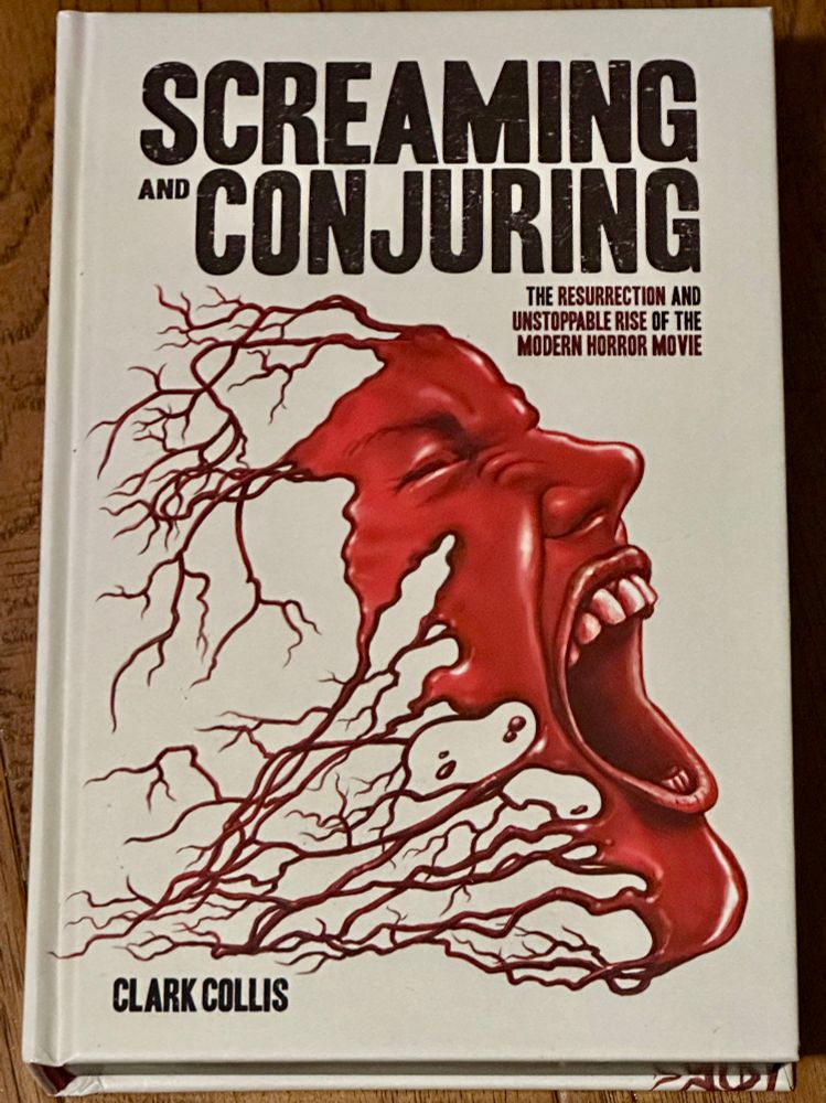 Co er of SCREAMING AND CONJURING, a bloody face, being formed by blood from blood vessels, screams.