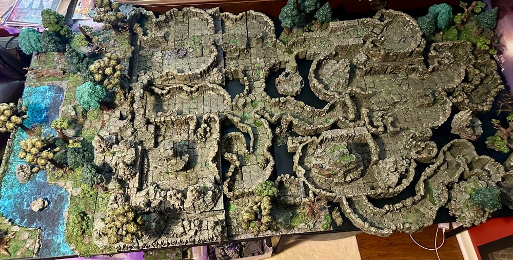 A large cavern system created with the Dwarven Forge line of products. This is 66” x 33” display populated with caverns and trees.