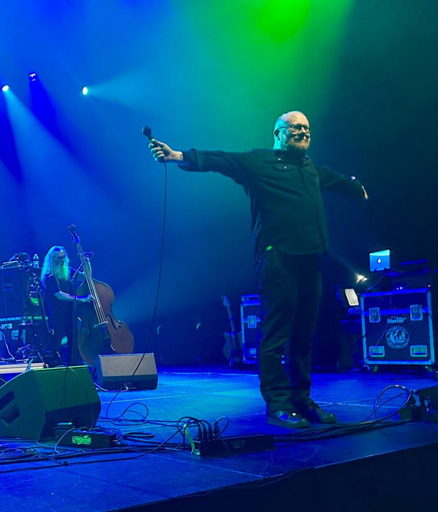A series of photos of Soul Coughing, a four piece band featuring a stand up bassist, a synth player/sampler, a jazz drummer, and a poet/occasional guitarist. A very colorful but simple stage show.