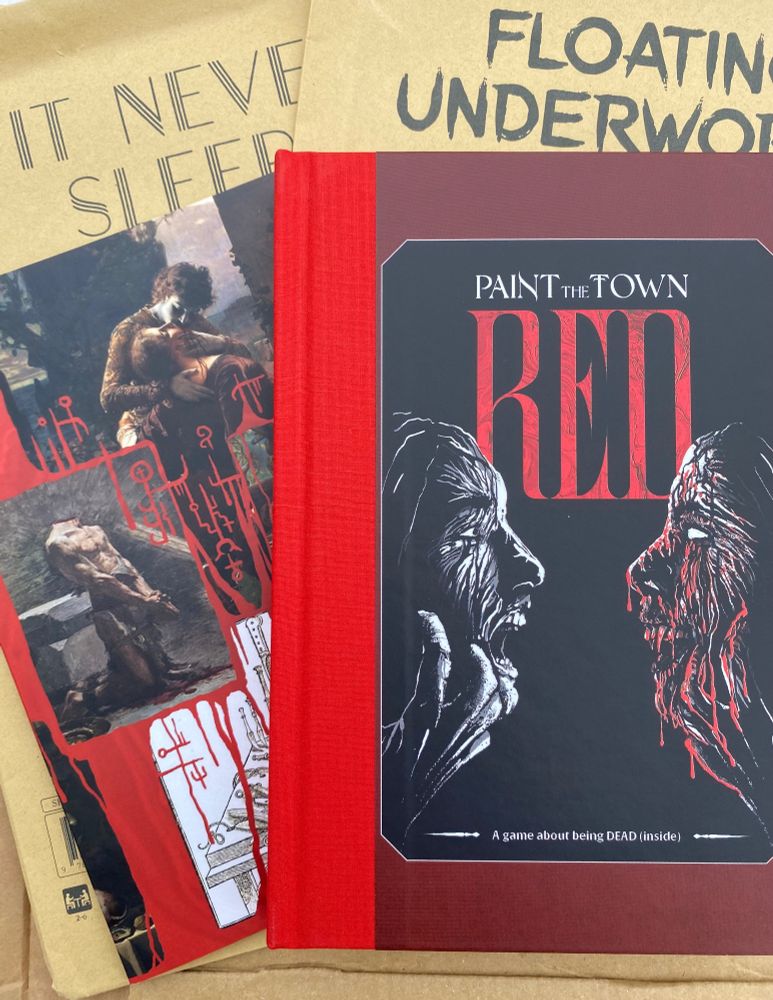 Paint The Town Red book, GM screen and two adventure envelopes. From Soulmuppet Publishing. 