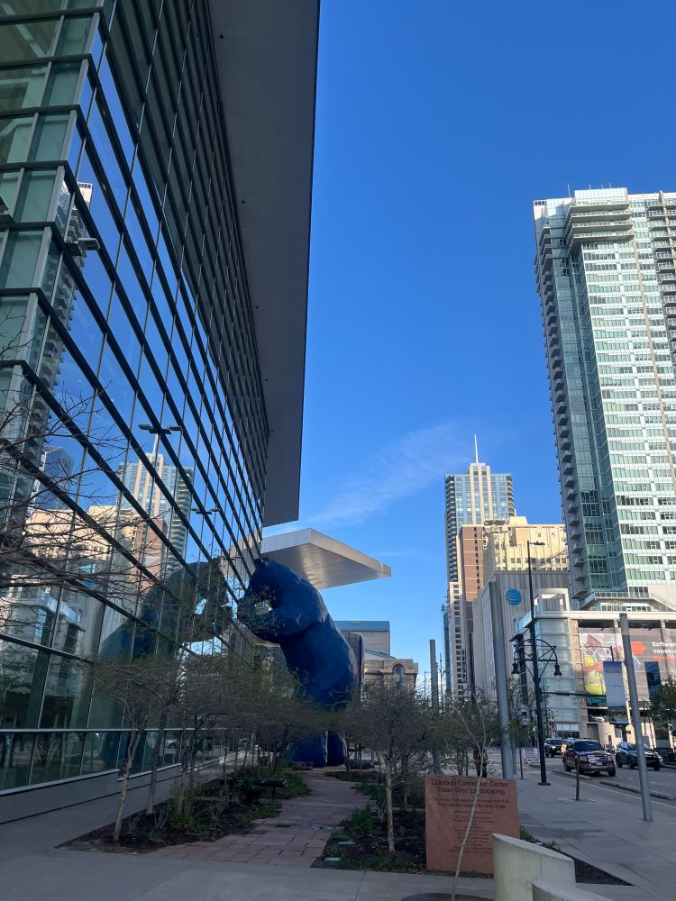 Denver’s Big Blue Bear peering in the window of the Colorado Convention Centre.