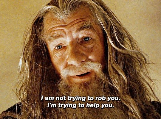 Ian McKellen as Gandalf, looking kindly and concerned, saying "I am not trying to rob you. I'm trying to help you."