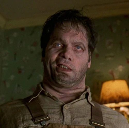 Edgar from Men in Black. An alien killed him and took his body as a suit of skin.