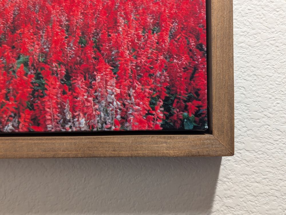 Closeup photo of floating miter wood picture frame to show the stain and finish